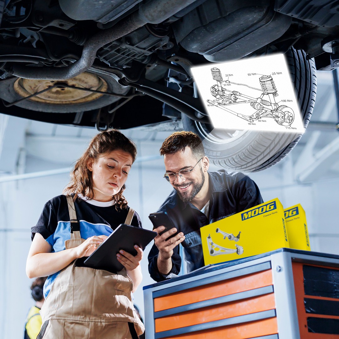 QRCode_TechnicalDrawing_MOOG Two installers looking at the MOOG Steering and Suspension technical drawing in a garage
