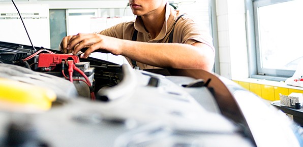 Mechanic-Inspecting-Car-Battery Mechanic-Inspecting-Car-Battery