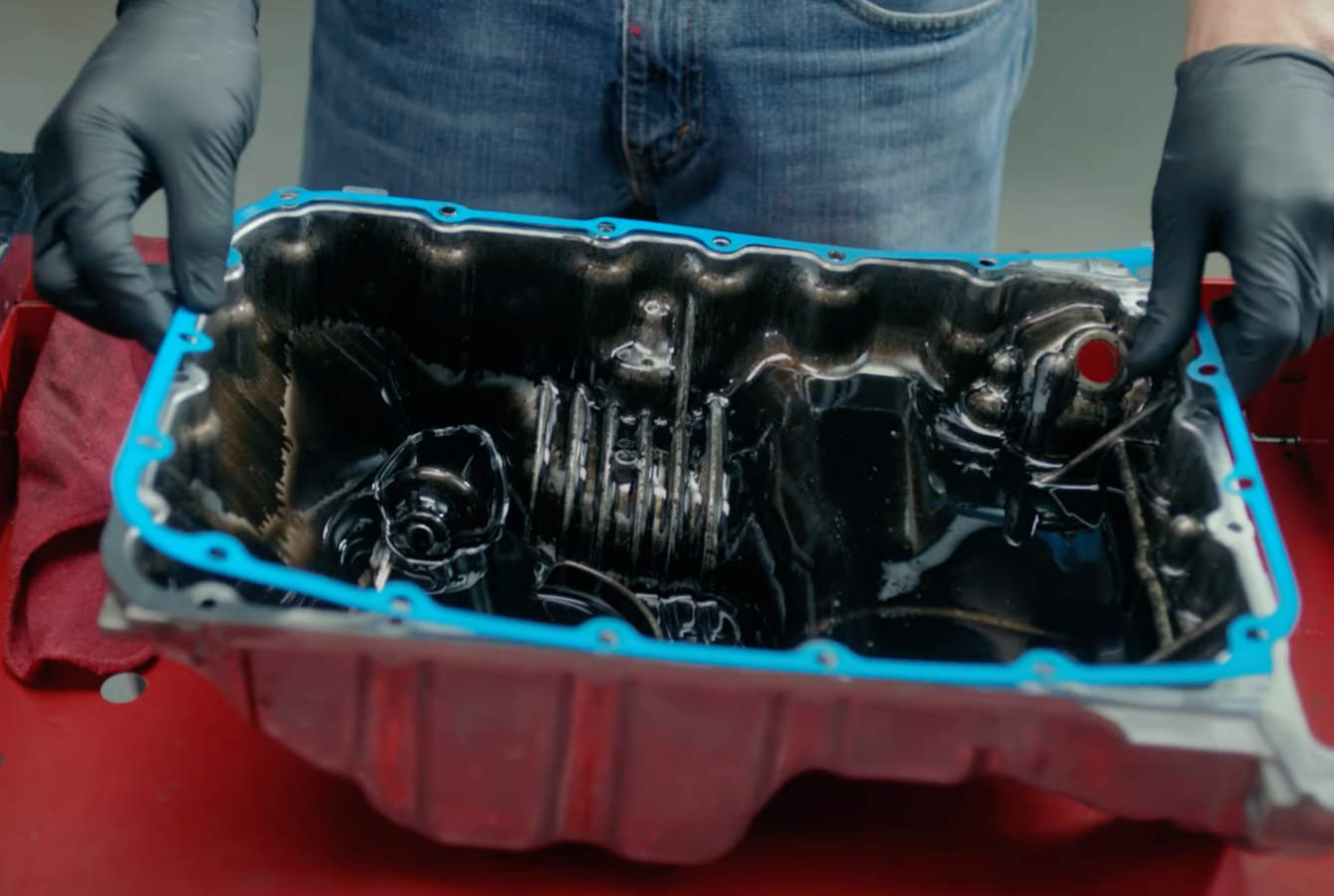 Auto tech pressing oil pan in case