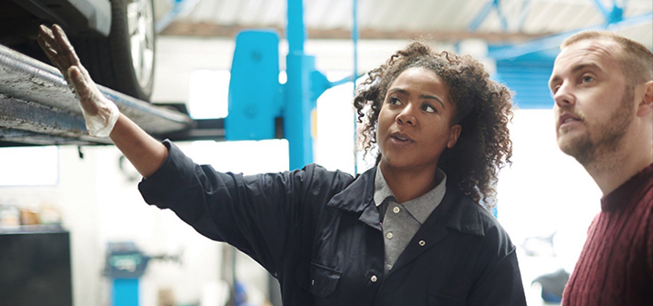 when-should-my-shocks-struts-be-inspected-hero Technician inspecting shocks.