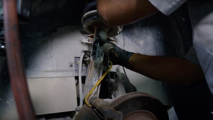 Removing strut assembly from vehicle Removing strut assembly from vehicle