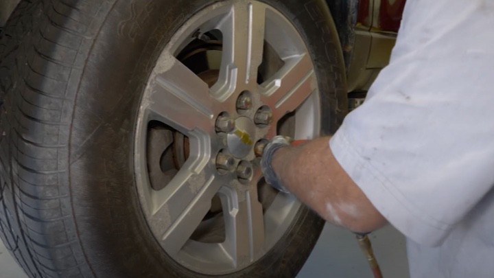 Putting wheel back on vehicle Putting wheel back on vehicle