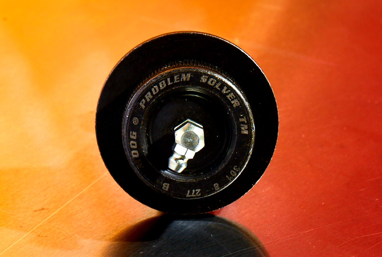 MOOG-Problem-Solver-Ball-Joint-On-Orange-Background