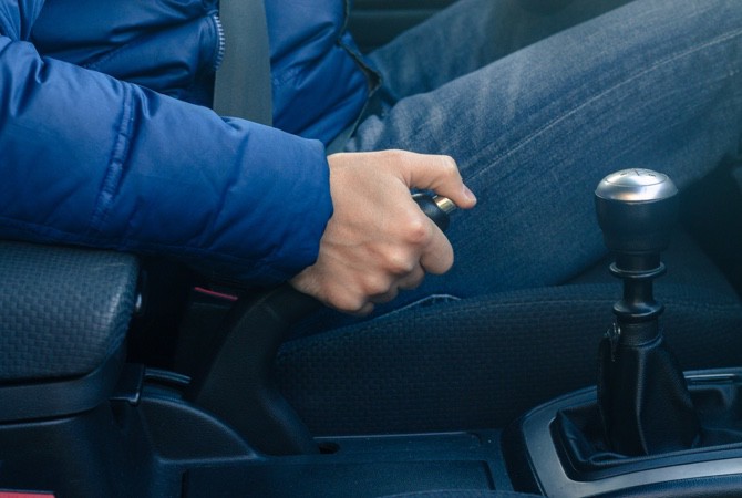 Driver-Pulling-Emergency-Brake Driver-Pulling-Emergency-Brake