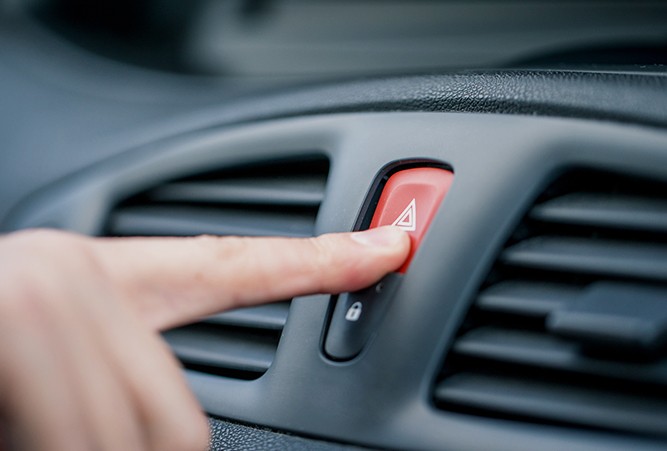 Driver-Pushing-Hazard-Button Driver-Pushing-Hazard-Button