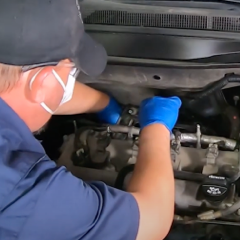 step-15-technician-reinstalling-support-bracket step-15-technician-reinstalling-support-bracket